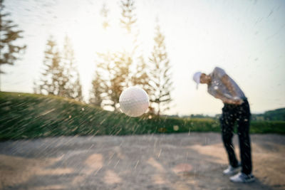 Man playing golf