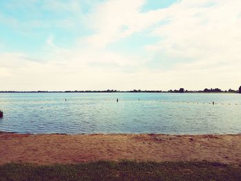 Scenic view of sea against cloudy sky