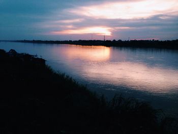 Scenic view of lake at sunset