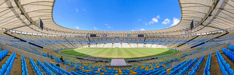 Low angle view of soccer ball against blue sky