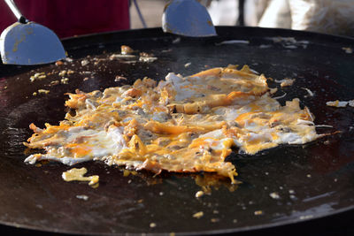 Close-up of meat in cooking pan