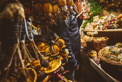 People in basket for sale at market stall