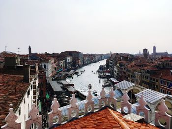 Panoramic view of people in city against clear sky