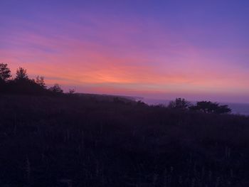 Scenic view of silhouette landscape against sky during sunset