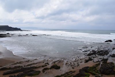 Scenic view of beach against sky