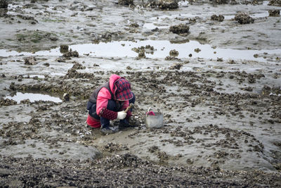 High angle view of girl on beach during winter