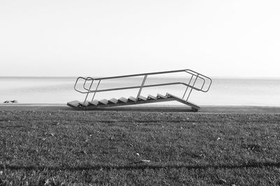 Scenic view of abandoned steps by lake balaton against clear sky