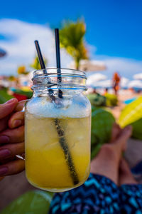 Close-up of hand holding drink