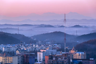 High angle view of townscape against sky during sunset