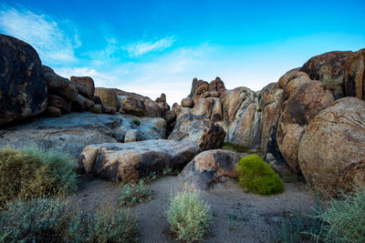 Rock formations  in desert landscape against sky