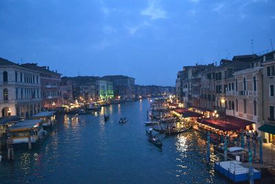 Boats in canal with buildings in background