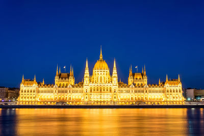 Illuminated city lit up at night