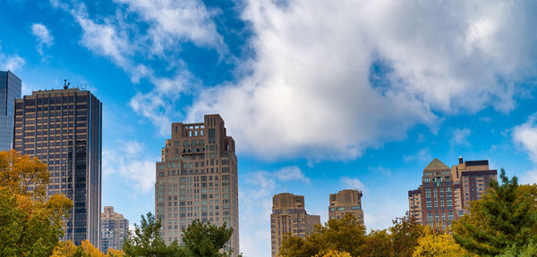 Panoramic view of buildings against blue sky