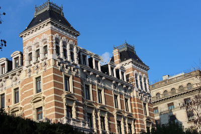 Low angle view of historical building against blue sky