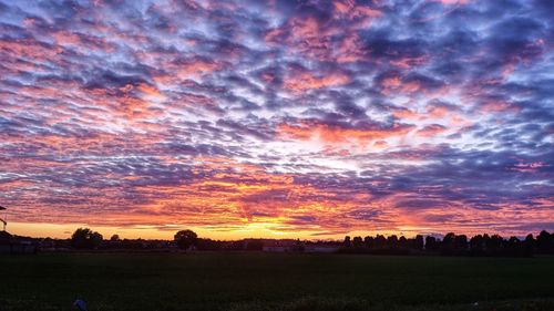 Scenic view of dramatic sky during sunset