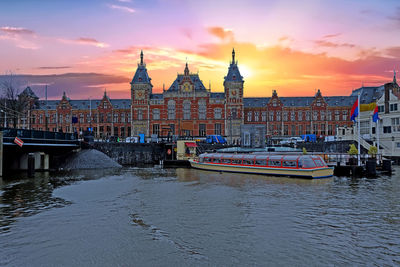Central station in amsterdam netherlands at sunset