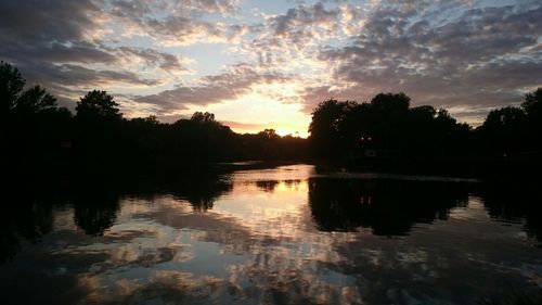 Scenic view of lake against cloudy sky