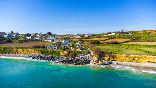 Scenic view of sea against clear blue sky