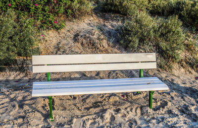 High angle view of empty bench in park