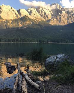 Scenic view of lake with mountains reflection