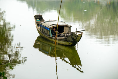 High angle view of fishing boat moored in lake