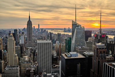 Modern buildings in city during sunset