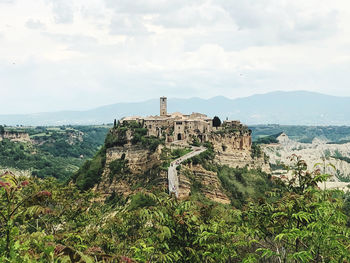 Castle on mountain against sky