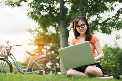 Young woman using mobile phone outdoors