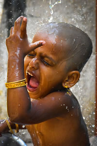 Close-up portrait of boy in water