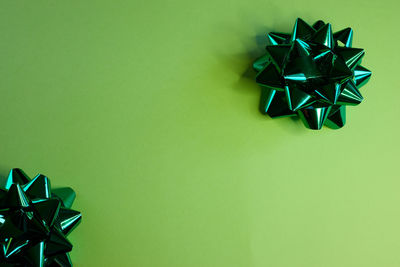 Directly above shot of christmas decorations on yellow background