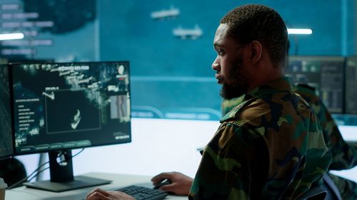 Side view of man working in office
