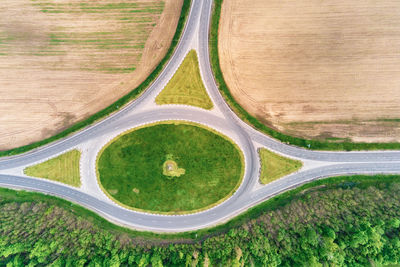 Circle crossroad among fields in countryside, aerial view. transportation infrastructure