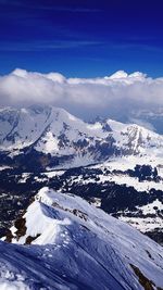 Scenic view of snow covered mountains