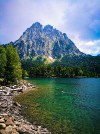 Scenic view of lake and mountains against sky