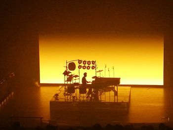 Silhouette people at observation point against sky during sunset