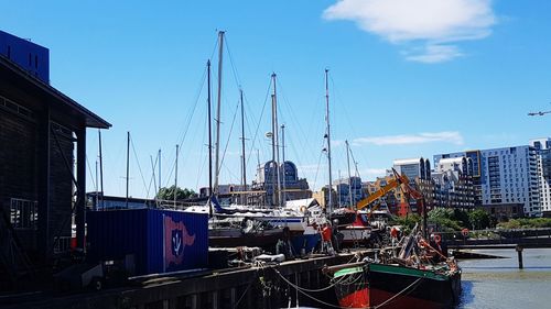 Boats moored at harbor