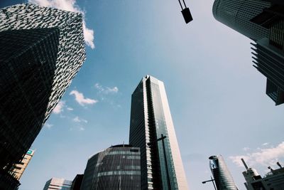 Low angle view of modern buildings against sky