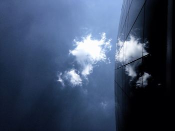 Low angle view of building against cloudy sky