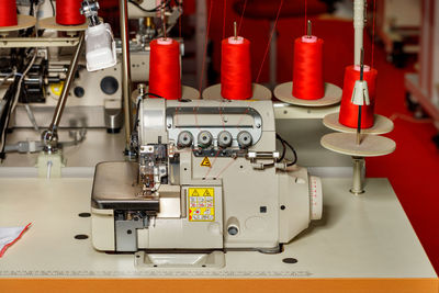 Modern sewing machine in a garment factory close-up.