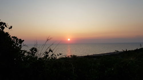 Scenic view of sea against sky during sunset