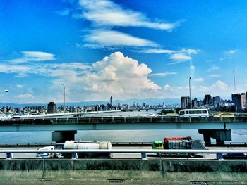 View of harbor against cloudy sky