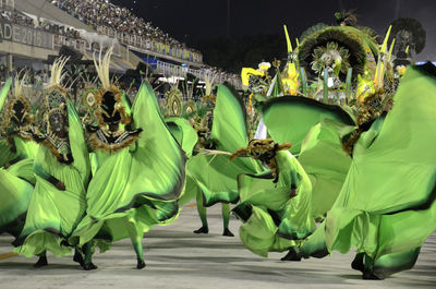 People in costumes dancing at carnival