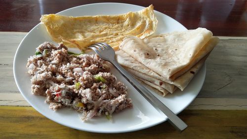 High angle view of mashuni and roshi served in plate on table