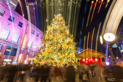 Illuminated christmas tree at night