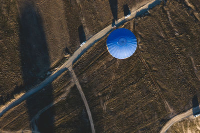 Aerial view of hot air balloon by road