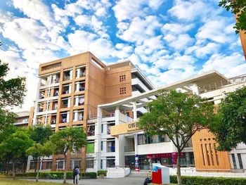 Low angle view of buildings in city against sky