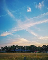 Scenic view of field against sky during sunset