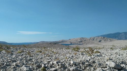 Panoramic view of landscape against blue sky