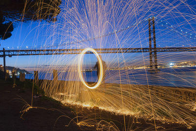 Light trails against sky at night