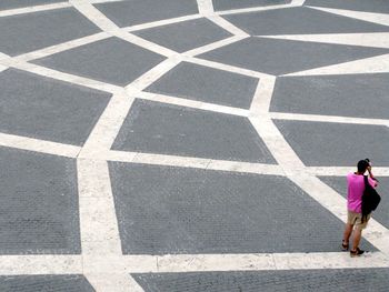 Woman walking on zebra crossing